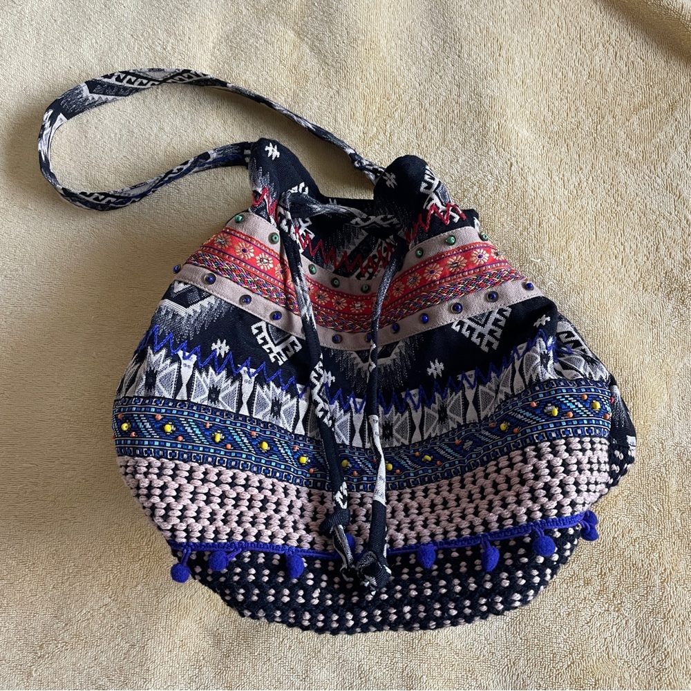 Stela 9 drawstring  bucket bag colorful design in good preowned condition
